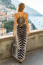 Animal print silk designer maxi dresses to wear on holiday by Lindsey Brown luxury resort wear