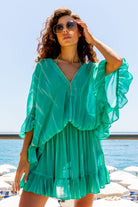 Aqua silk bloused kaftan dress to wear over swimwear by Lindsey Brown resort wear