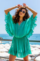 Aqua green silk kaftan dress to wear on a luxury holiday by Lindsey Brown resort wear