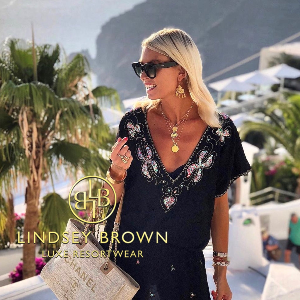 Black bloused drop waisted beach dress by Lindsey Brown luxury resort wear