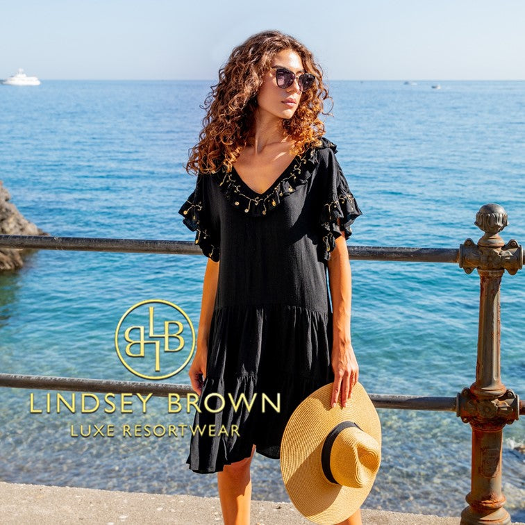 Black designer beach dresses to wear day or night in the Caribbean. Stay stylish wearing our black designer beach dresses on your next getaway by Lindsey Brown resort wear