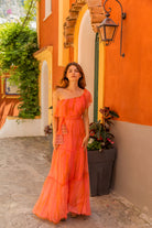 Coral Orange silk tie dye floaty maxi dress to wear on holiday by Lindsey Brown resort wear
