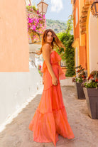 Orange and Coral strapless silk maxi dress to wear on holiday by Lindsey Brown luxury resort wear