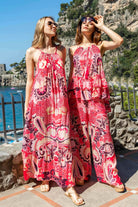 Coral pink black sleeveless maxi dresses by Lindsey Brown luxury resort wear