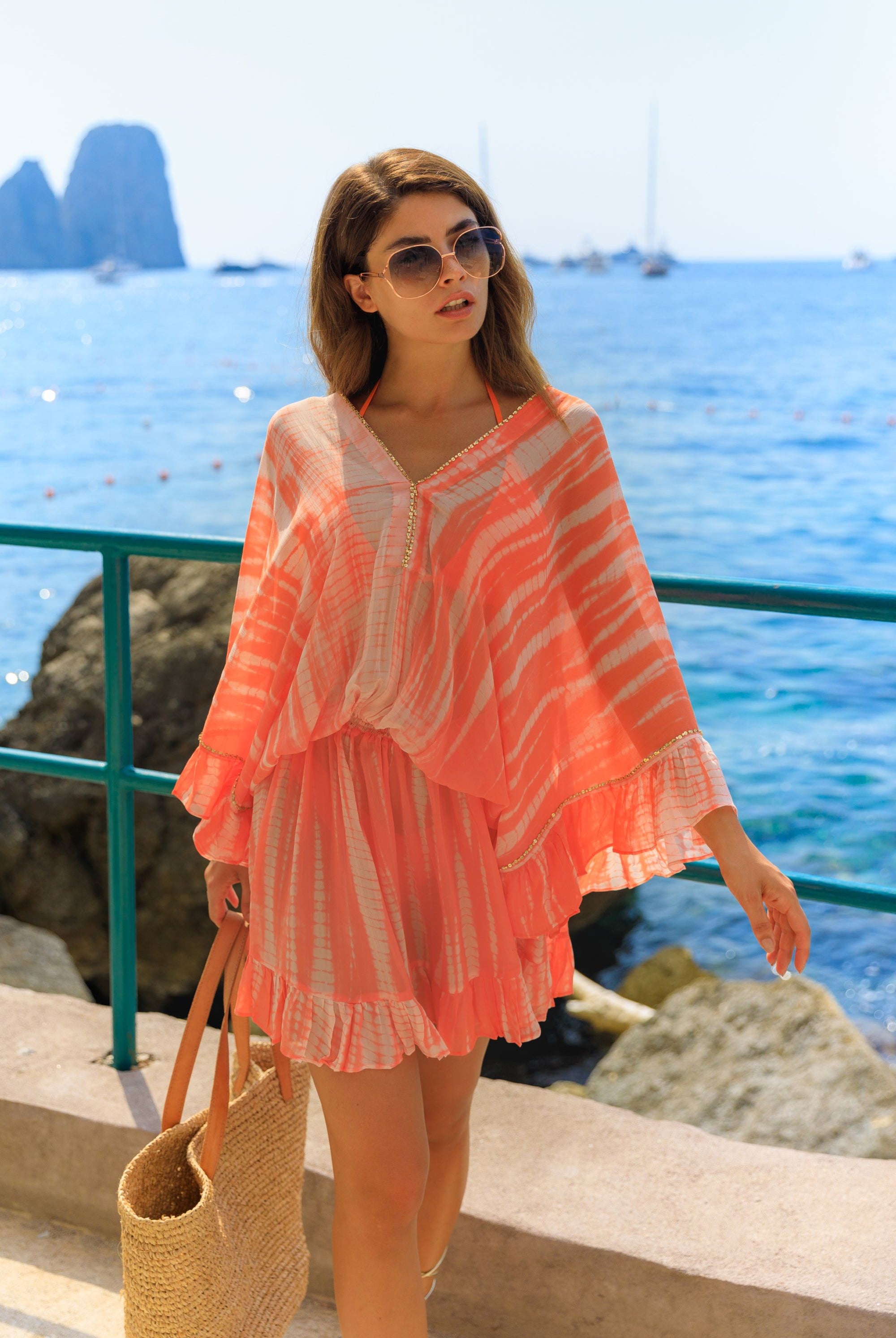Orange silk luxury kaftan dresses to wear on holiday by Lindsey Brown luxury resort wear 