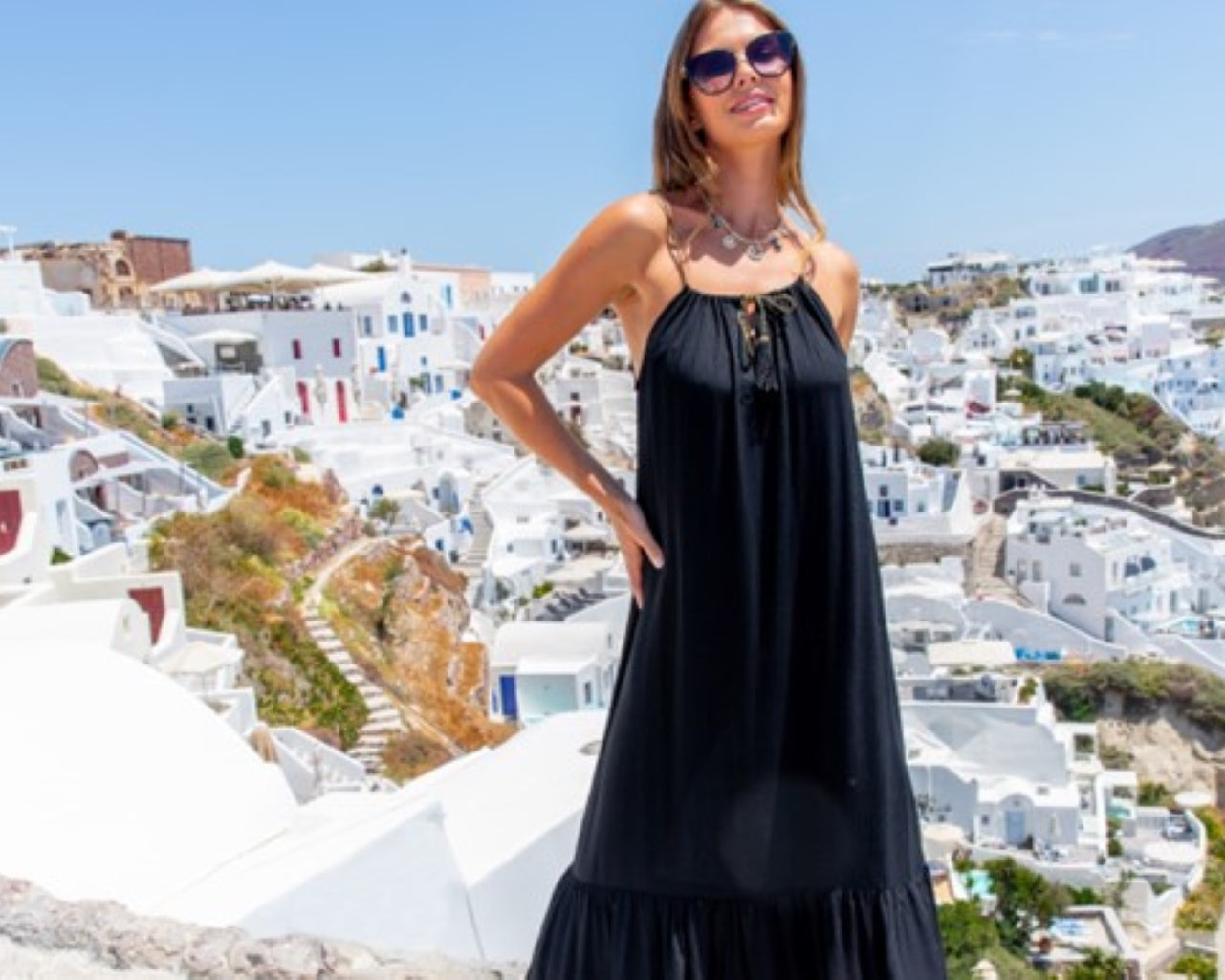 Sleeveless black designer beach dresses by Lindsey Brown luxury resort wear