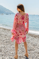 Stunning silk long sleeve silk dress to wear on holiday by Lindsey Brown luxury resort wear