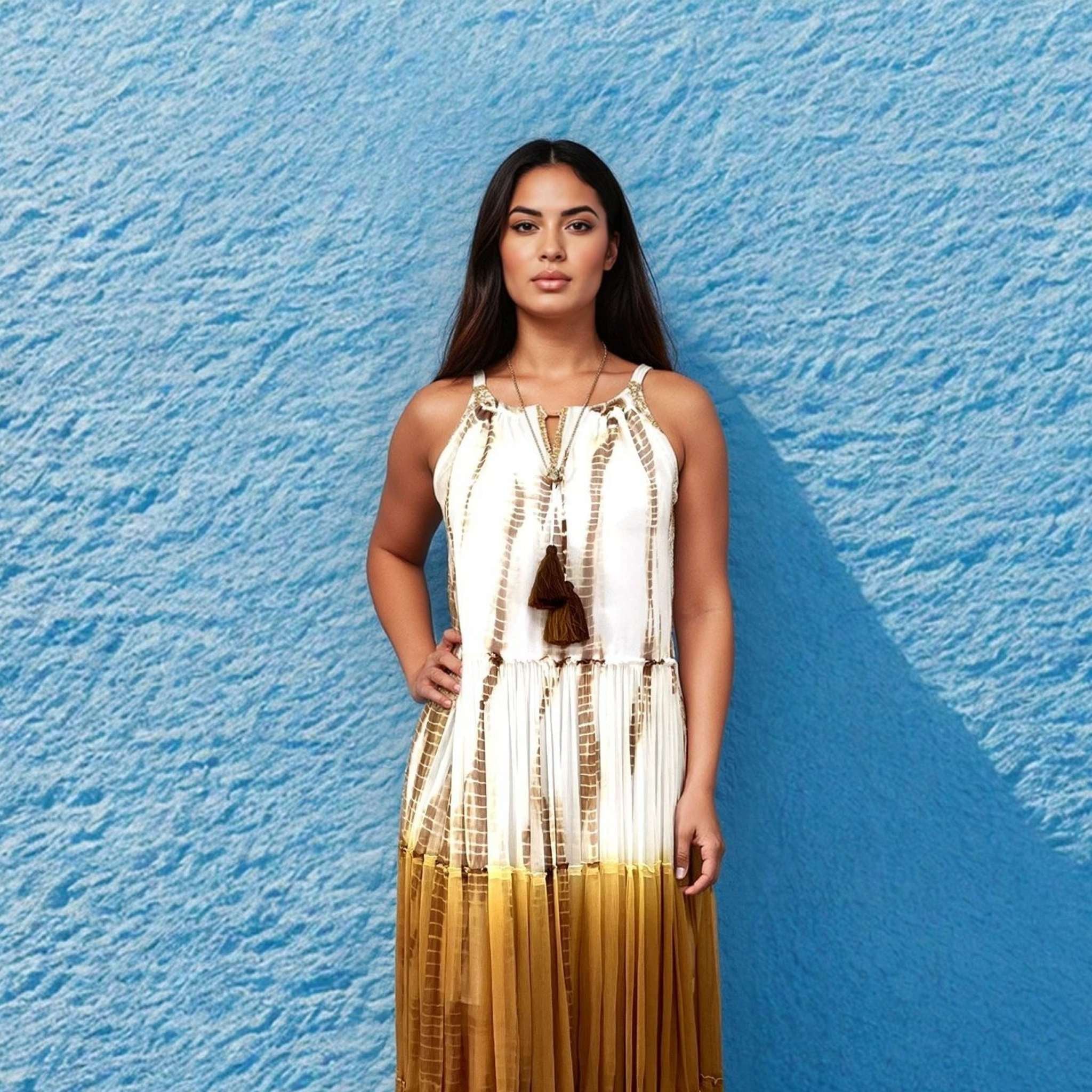 White and tan silk sleeveless maxi dresses by Lindsey Brown resort wear to wear on holiday