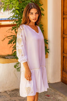 White gold beach dress in soft cotton with long sleeves by Lindsey Brown resort wear