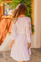 White gold floaty beach dress with pretty gold sleeve detail by Lindsey Brown resort wear