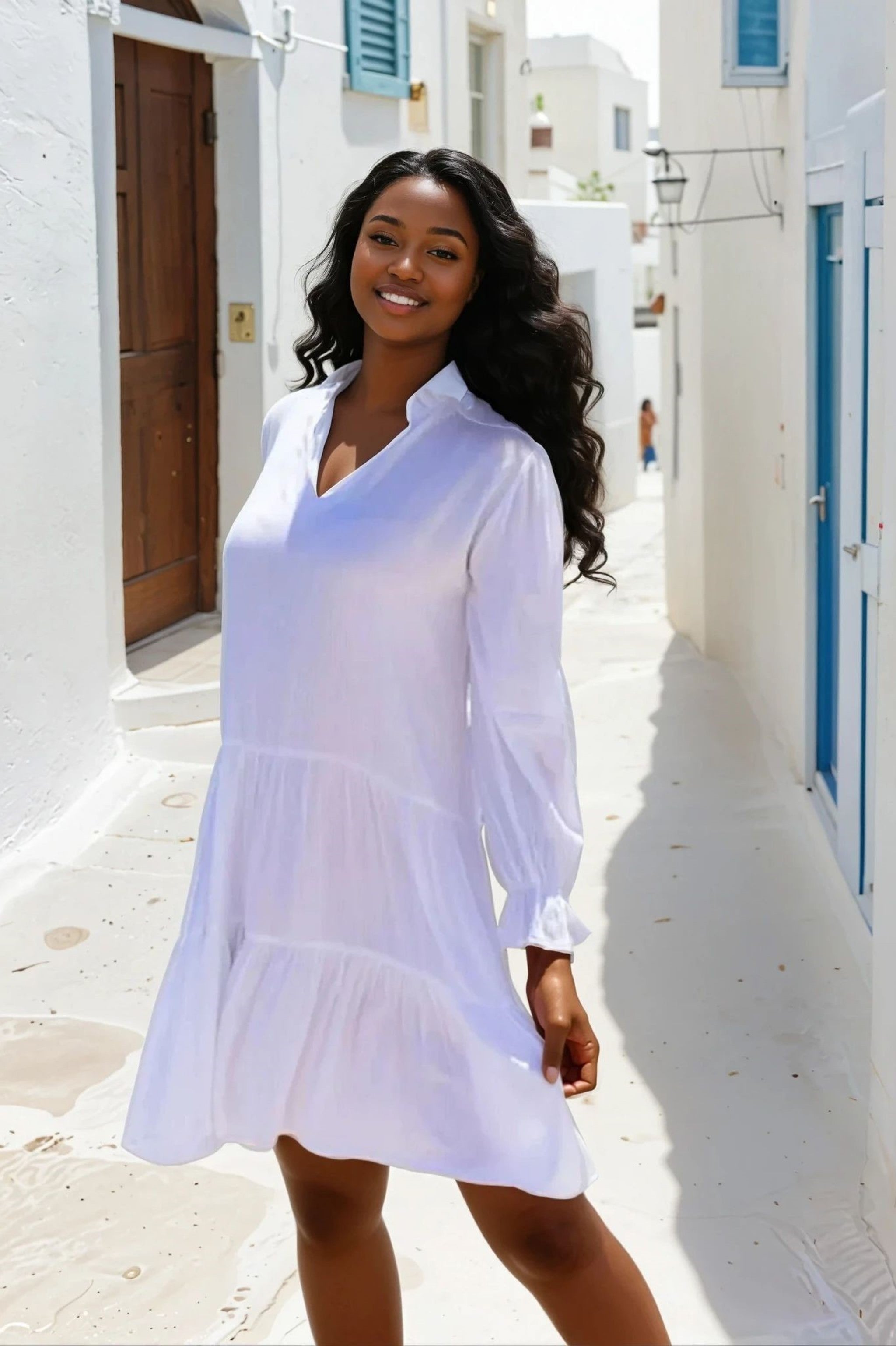 White cotton tiered dress to wear on holiday by Lindsey Brown cototn resort wear