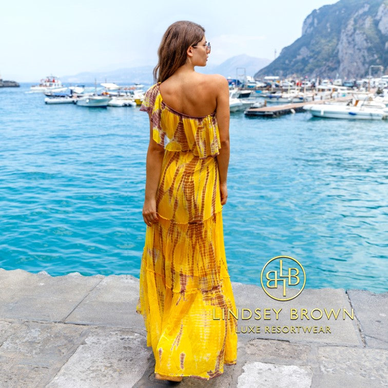 yellow luxury silk maxi resort wear dresses to wear on holiday by Lindsey Brown resort wear