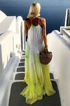Yellow silk maxi dresses to wear in Santorini by Lindsey Brown resort wear