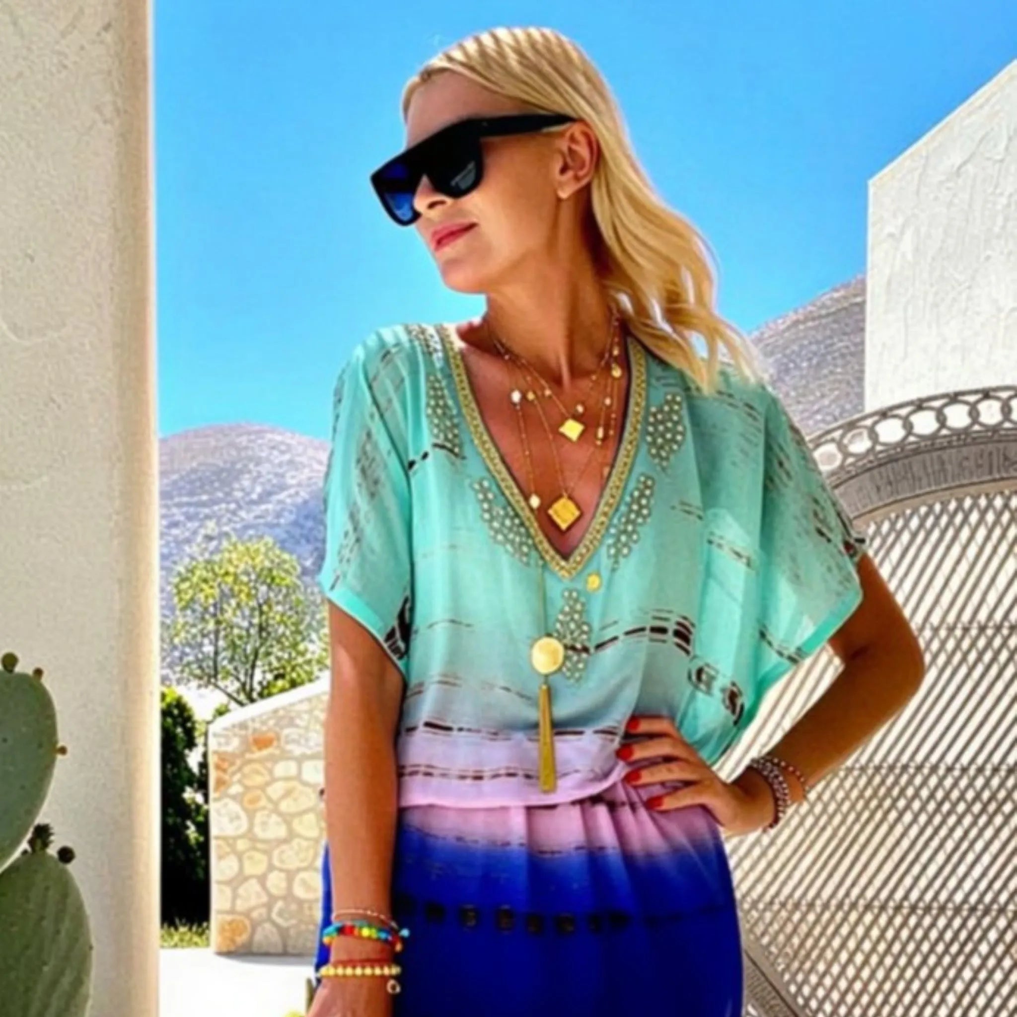 aqua and gold ombre silk kaftan dress to wear on a luxury holiday by lindsey brown silk resort wear