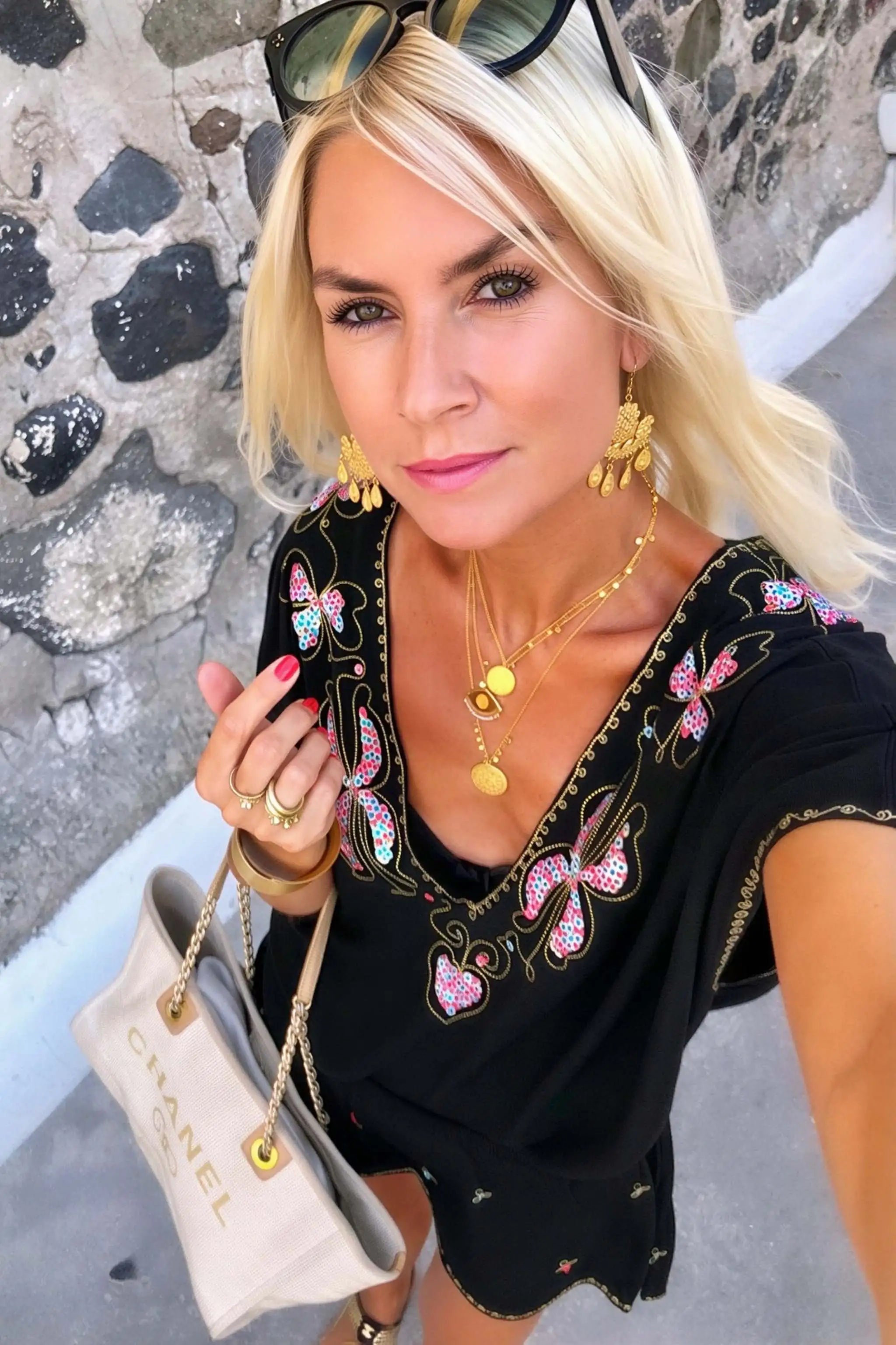 black cotton beach dress with gold embroidery to wear on holiday by lindsey brown resort wear
