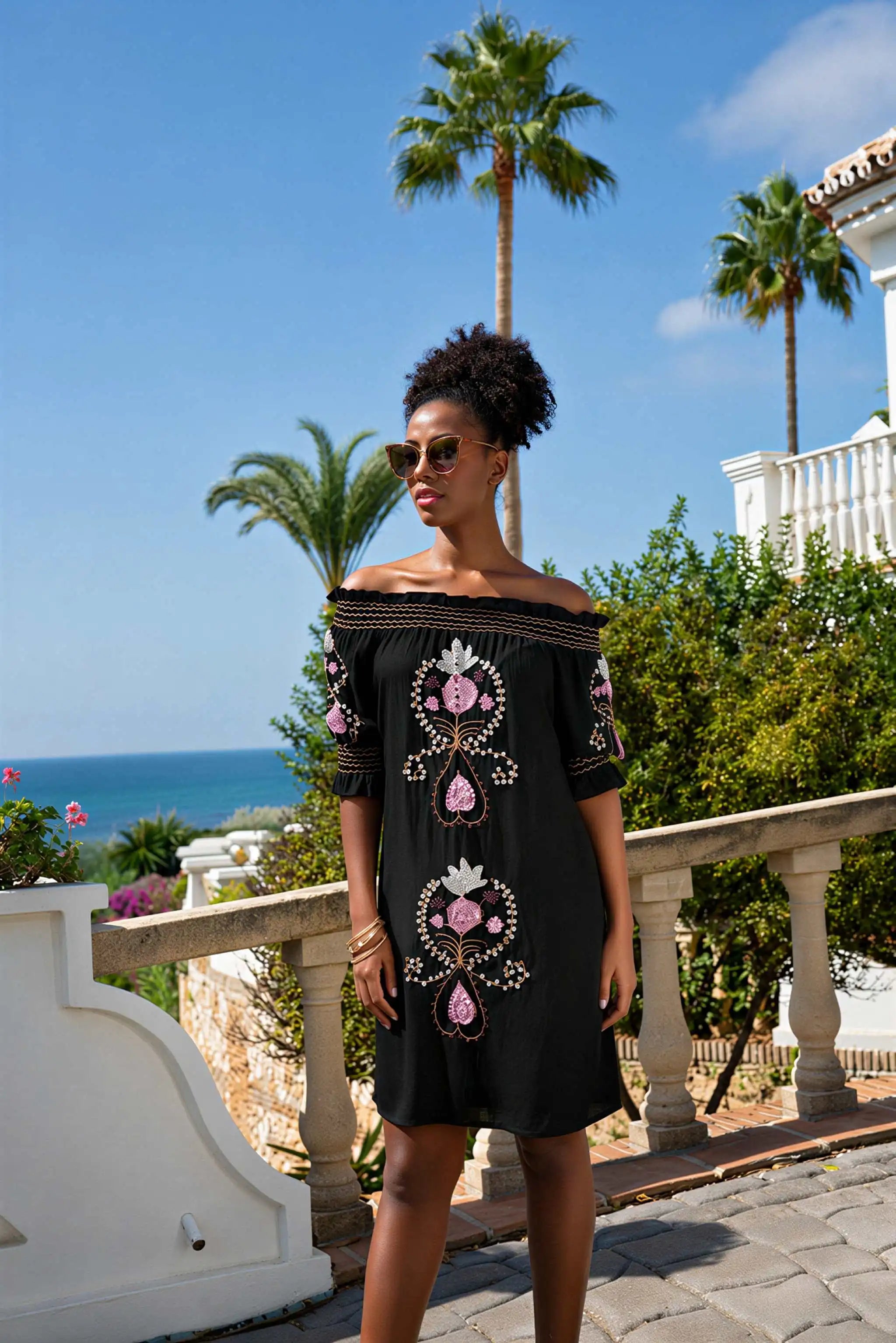 black strapless off the shoulder dress to wear on holiday by lindsey brown