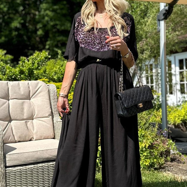 black wide leg trousers to wear on holiday by lindsey brown resort wear 