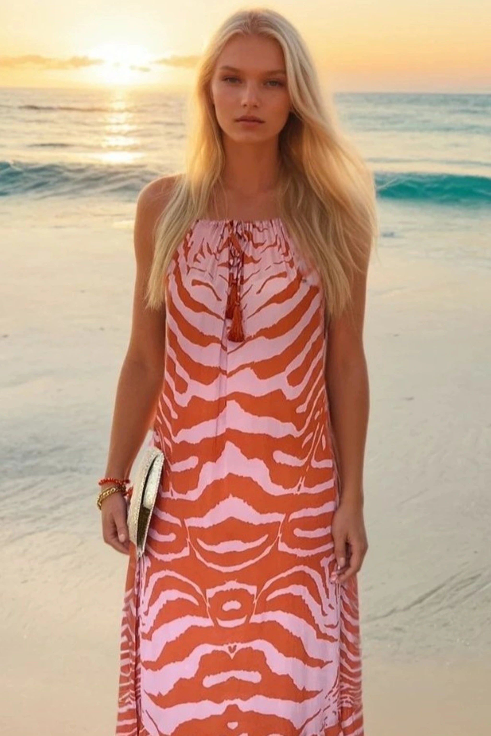 orange and pink floaty sleeveless maxi dress to wear on vacation by Lindsey Brown resort wear