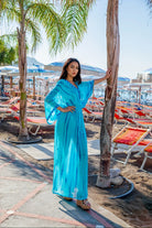 turquoise blue silk maxi kaftans to wear on a warm summer holidays by Lindsey Brown