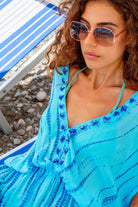 turquoise blue silk luxury resort wear kaftans by  Lindsey Brown
