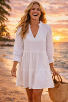 white cotton long sleeved beach dress to wear to the beach