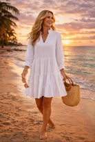 white cotton long sleeved beach dress to wear to the beach on holiday
