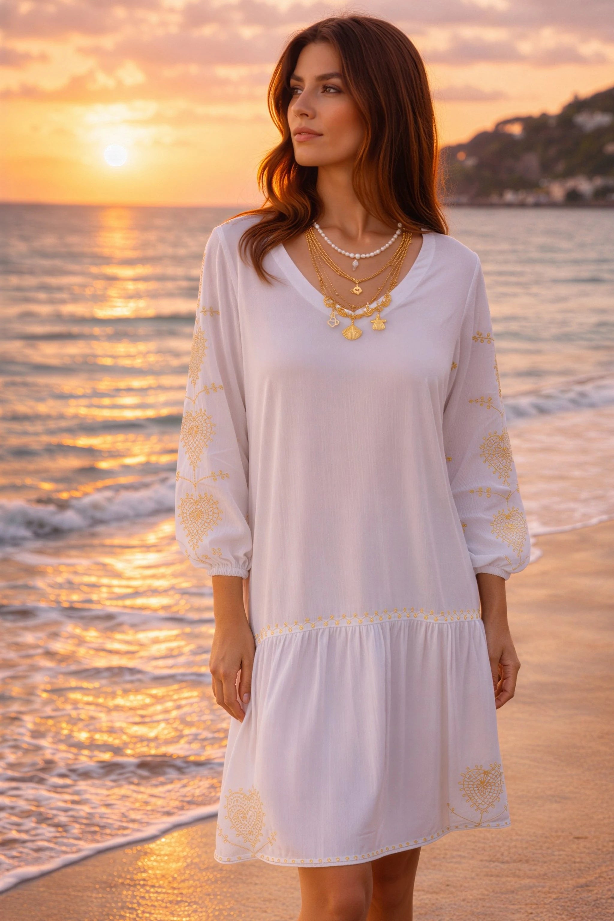 white v neck cotton beach dress with long sleeves and gold sleeve embroidery