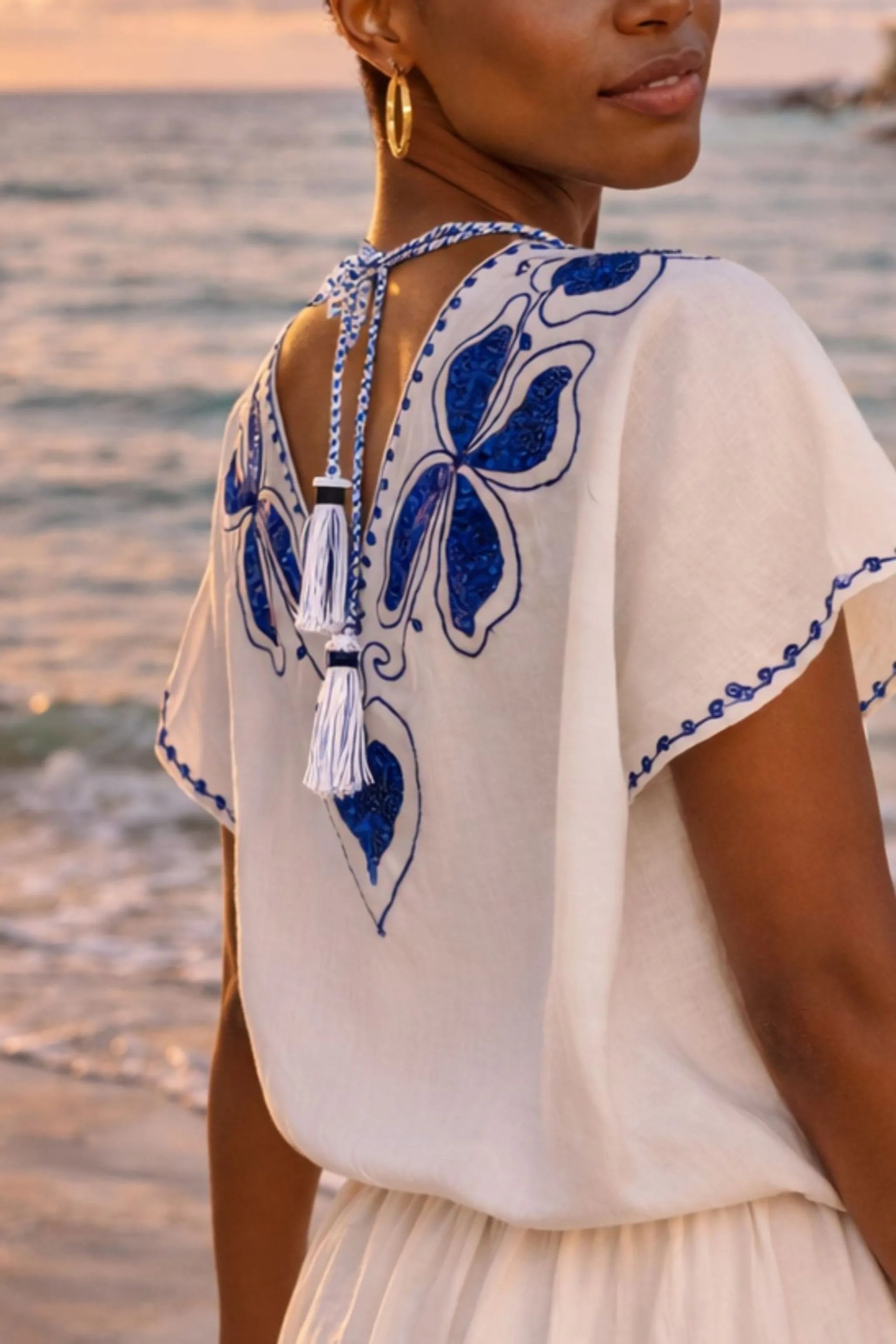white blue low v back cotton beach dresses for caribbean holidays