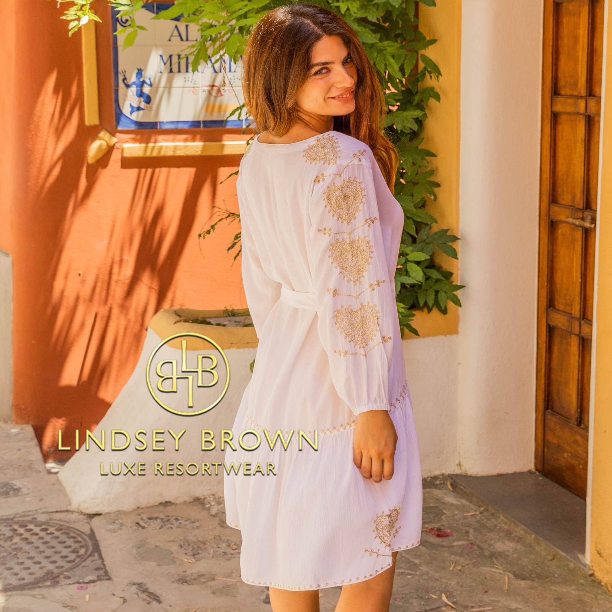 white designer beach dresses to wear on holiday by Lindsey Brown resort wear