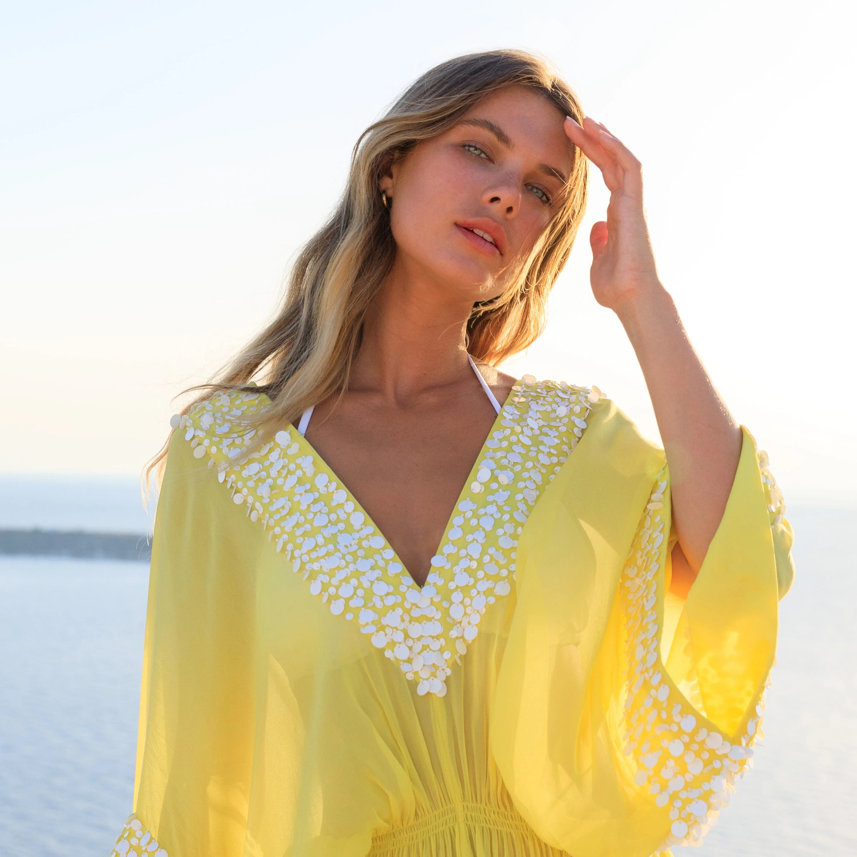 yellow and white short silk designer kaftans to wear on holiday in Santorini by lindsey brown silk resort wear