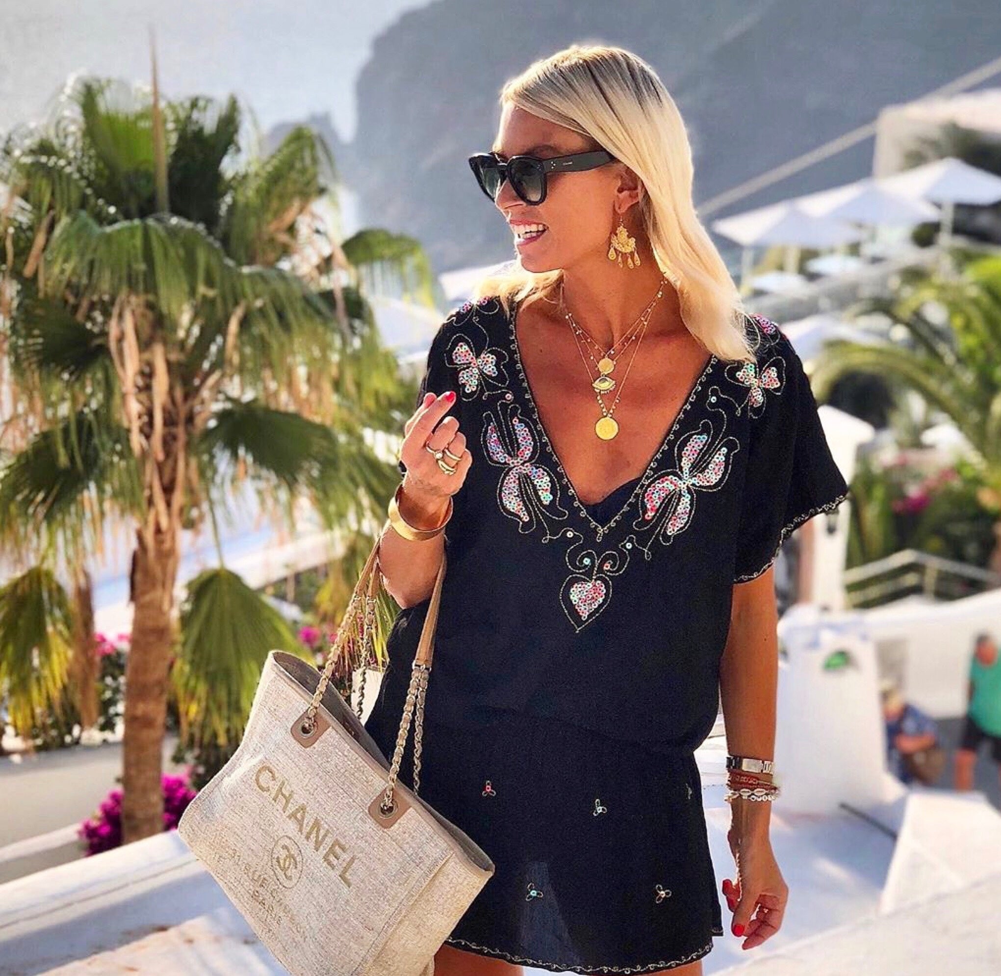 Anna Mavridis wears black designer beach dress by Lindsey Brown resort wear 