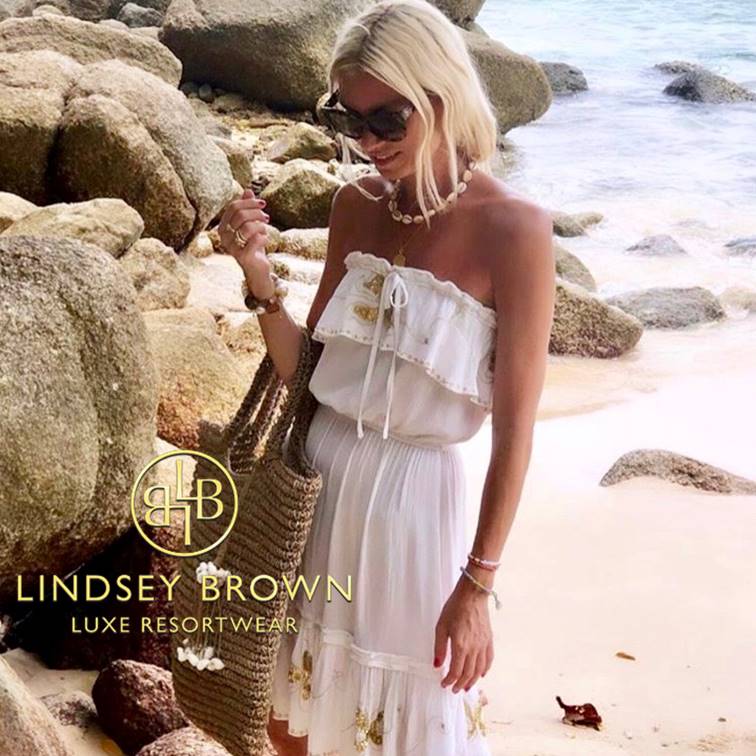 Anna Mavridis wears white strapless beach dress by lindsey brown
