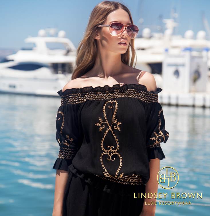 Casey Batchelor wears black designer bardot top by Lindsey Brown resort wear