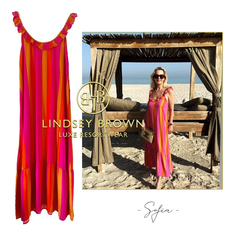 Pink Orange Stripe holiday dress worn by Andrea StyleIconAndMore by lindsey brown luxury resort wear 
