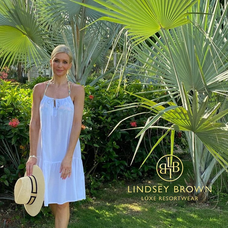 pretty white designer beach dress to wear on holiday 