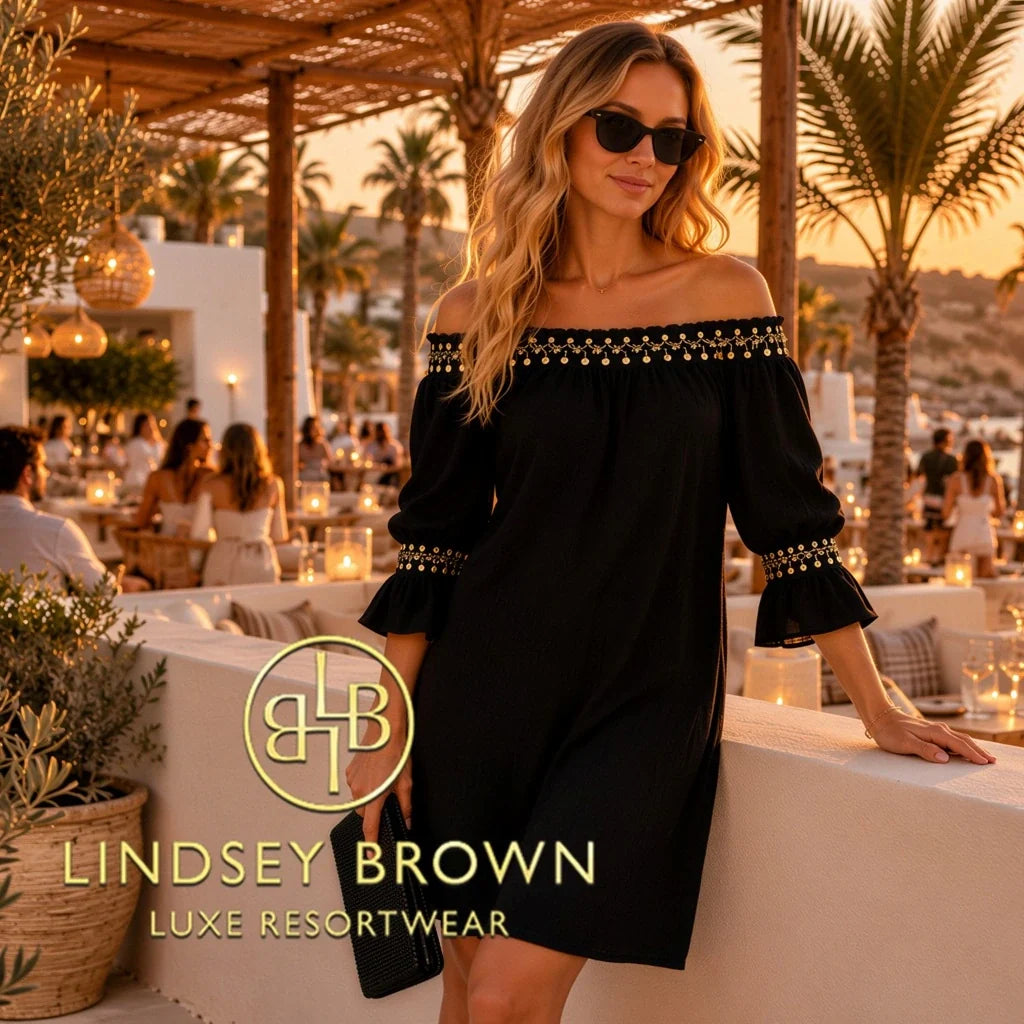 Branded collection image for embellished off the shoulder black crinkle cotton beach dress, worn on warm winter sun holidays by Lindsey Brown resort wear.
