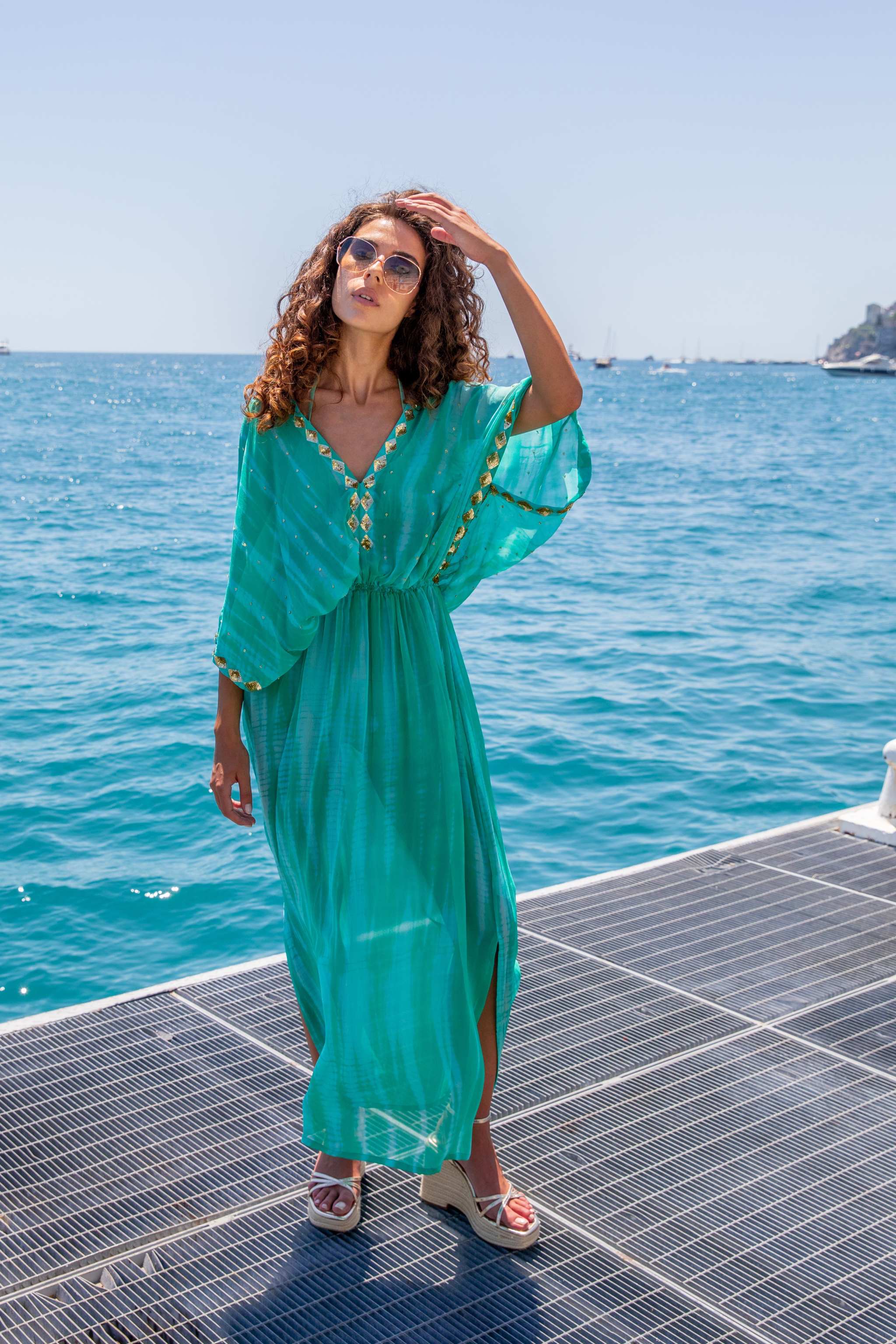 Aqua silk kaftan maxi dresses to wear over swimwear in a luxury resort by Lindsey Brown