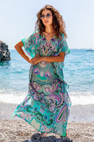 Aqua silk maxi designer kaftan to wear on holiday by Lindsey Brown luxury resort wear