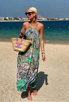 Aqua silk maxi dress to wear on holiday by Lindsey Brown luxury resort wear  worn by Anna Mavridis