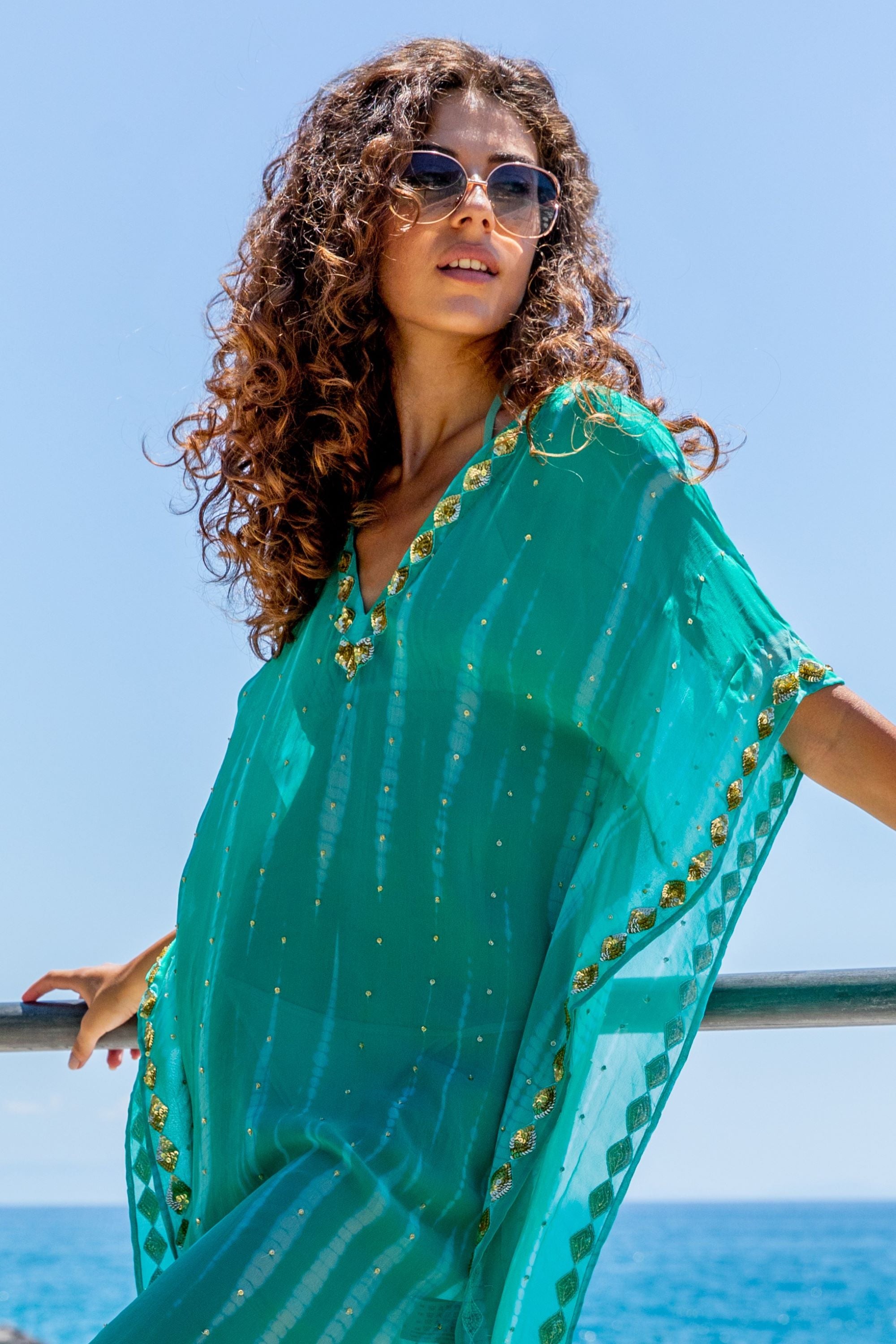 Aqua gold silk floaty tie dye kaftan to wear  in the Maldvies by Lindsey Brown luxury resort wear 