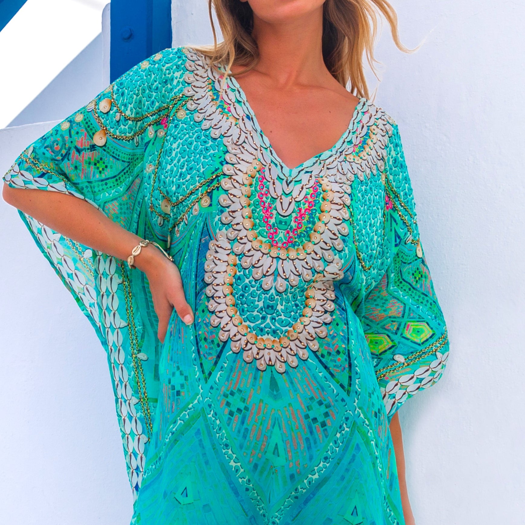 Aqua short silk designer beach kaftan called Rhodes is a beautiful opaque knee length designer beach coverup by Lindsey Brown luxury resort wear