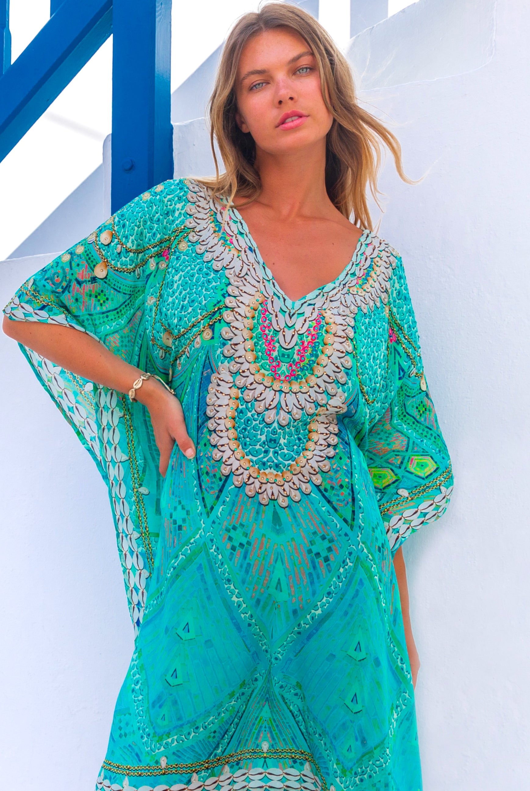 Aqua short silk designer beach kaftan called Rhodes is a beautiful opaque knee length designer beach coverup by Lindsey Brown luxury resort wear