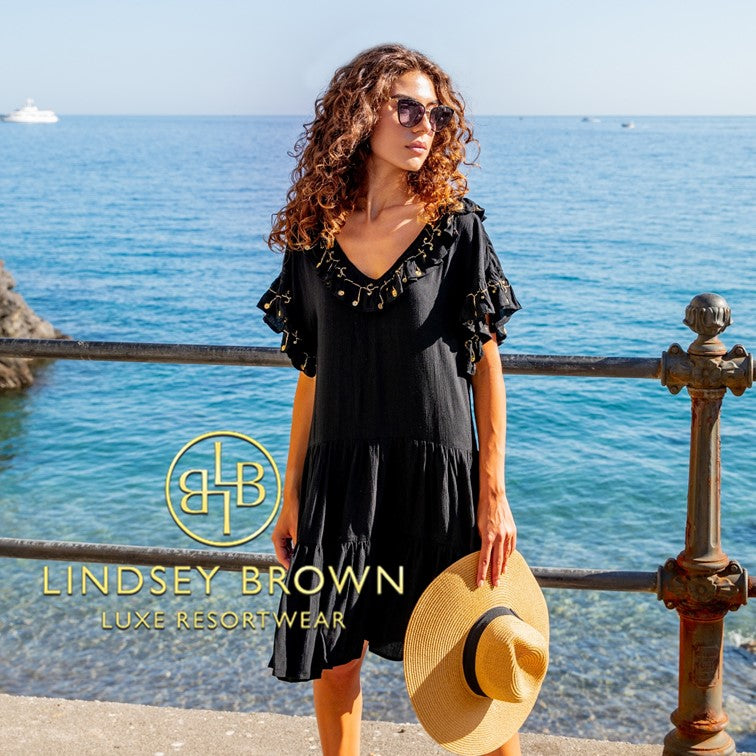 Black designer beach dresses to wear day or night in the Caribbean. Stay stylish wearing our black designer beach dresses on your next getaway by Lindsey Brown resort wear 
