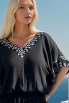 Black drop waisted cotton bloused beach dress to wear on holiday by Lindsey Brown resort wear 