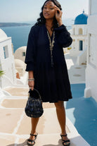 Black plus size cotton tiered dress to wear in summer, with long sleeves by Lindsey Brown cotton resort wear 