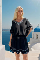 Black drop waisted cotton bloused beach dress to wear on holiday by Lindsey Brown cotton resort wear 