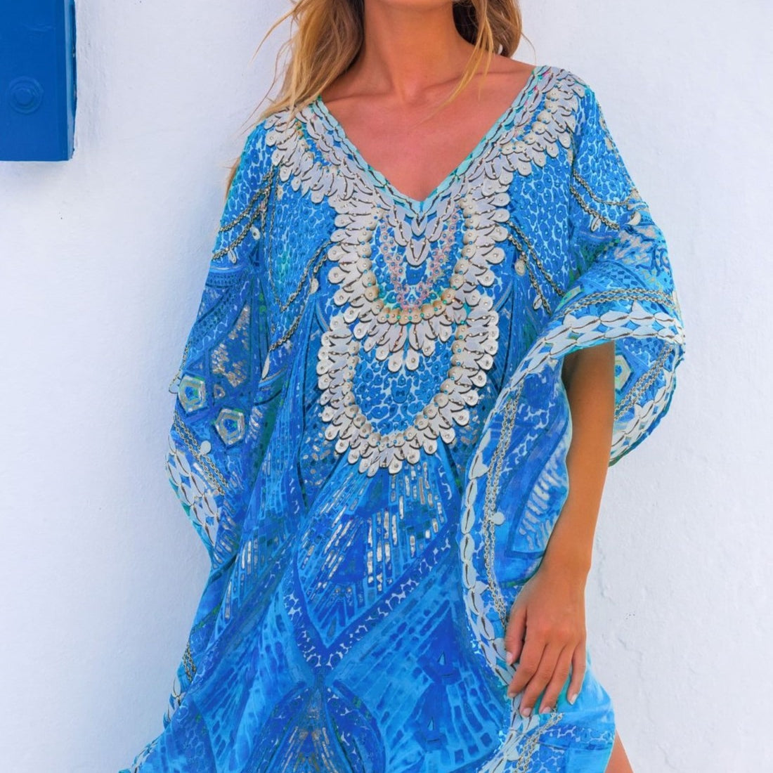 Blue silk floaty designer kaftans by Lindsey Brown resort wear to wear on holiday