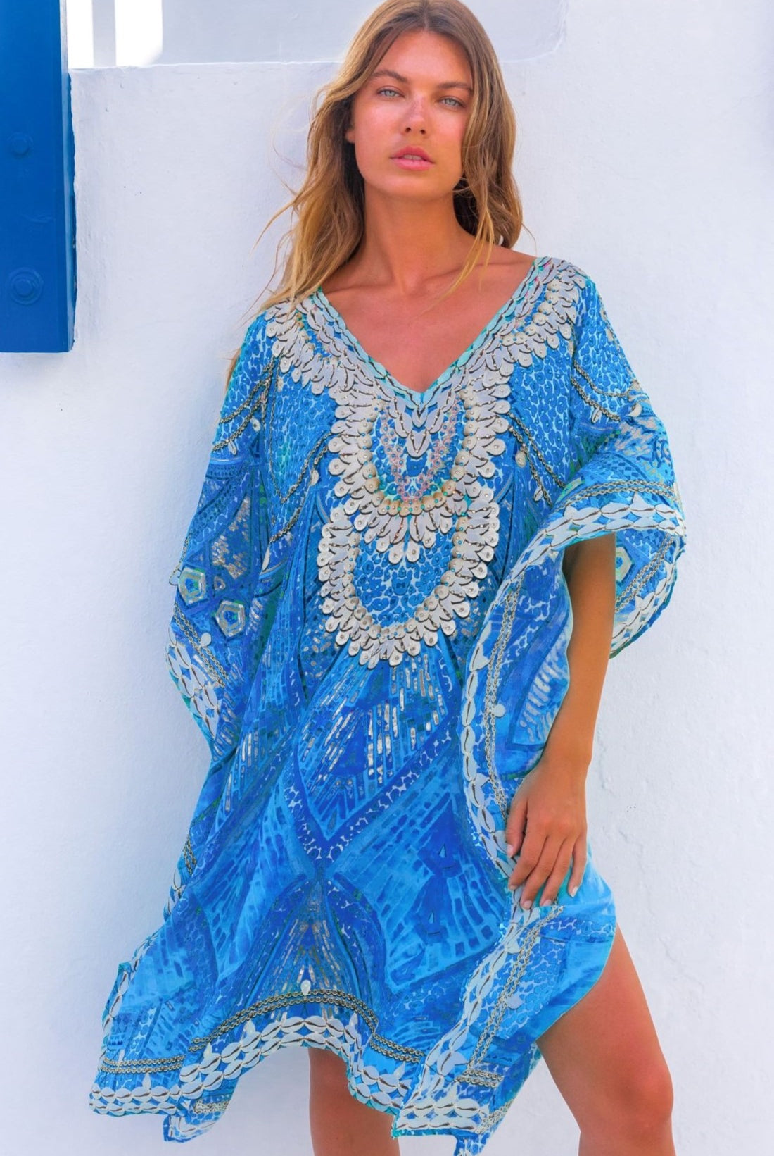Blue silk floaty designer kaftans by Lindsey Brown resort wear to wear on holiday