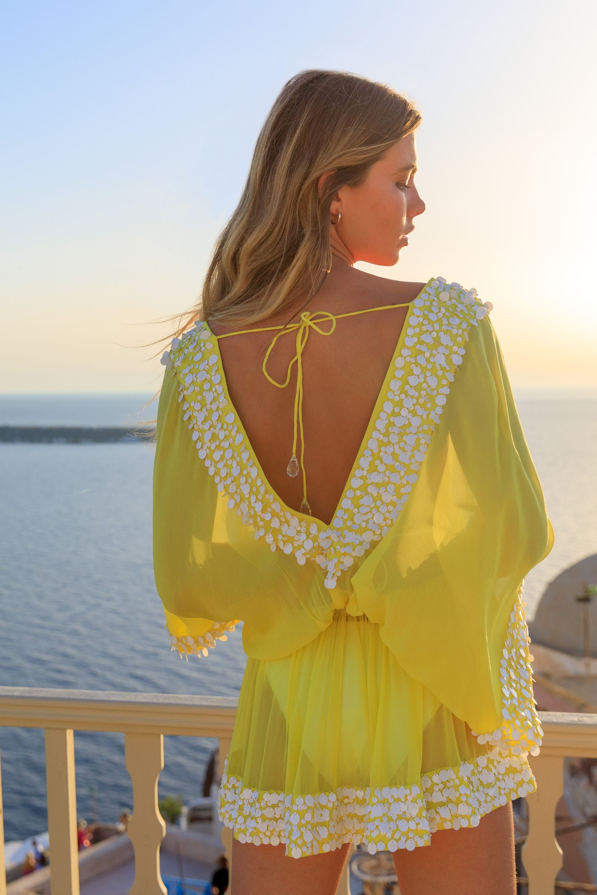 Bright yellow silk luxury designer kaftans and luxury resort wear by Lindsey Brown