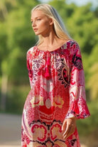 Pink printed silk resort wear dress to wear on holiday by Lindsey Brown resort wear